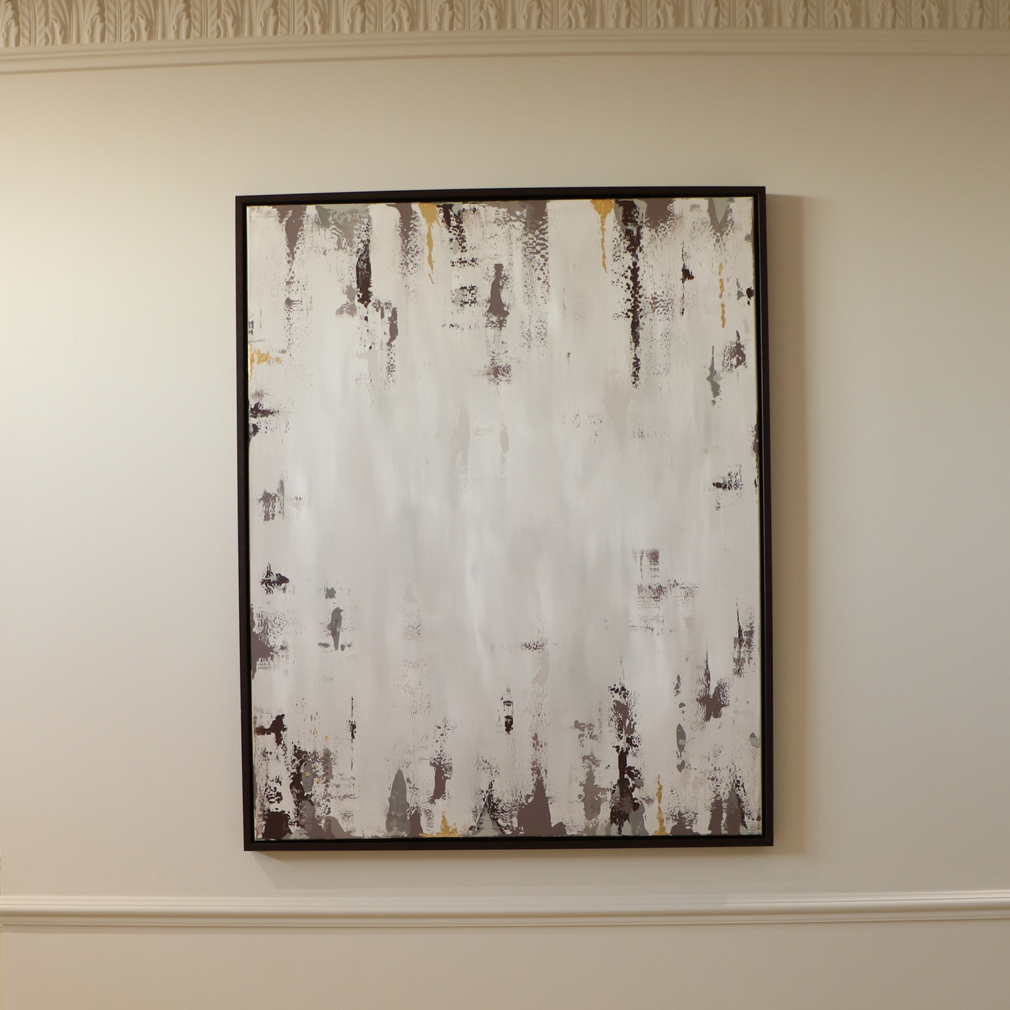 Abstract painting on a wall with a neutral color palette